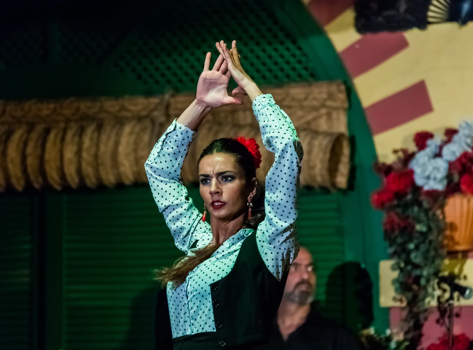 Flamenco dancer performing with raised arms at Palacio Andaluz in Seville Spain 2015 — Flamenco (File 00363, Spain, 2010) is inscribed on UNESCO's Representative List of the Intangible Cultural Heritage of Humanity as one of Europe's most internationally recognized performing arts inscriptions