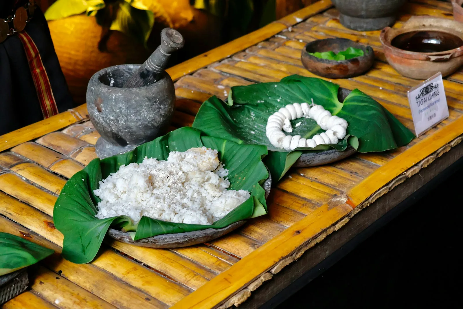 Traditional Tapai Lihing rice dish on banana leaves — Domain 4 of UNESCO ICH covers knowledge and practices concerning nature and food