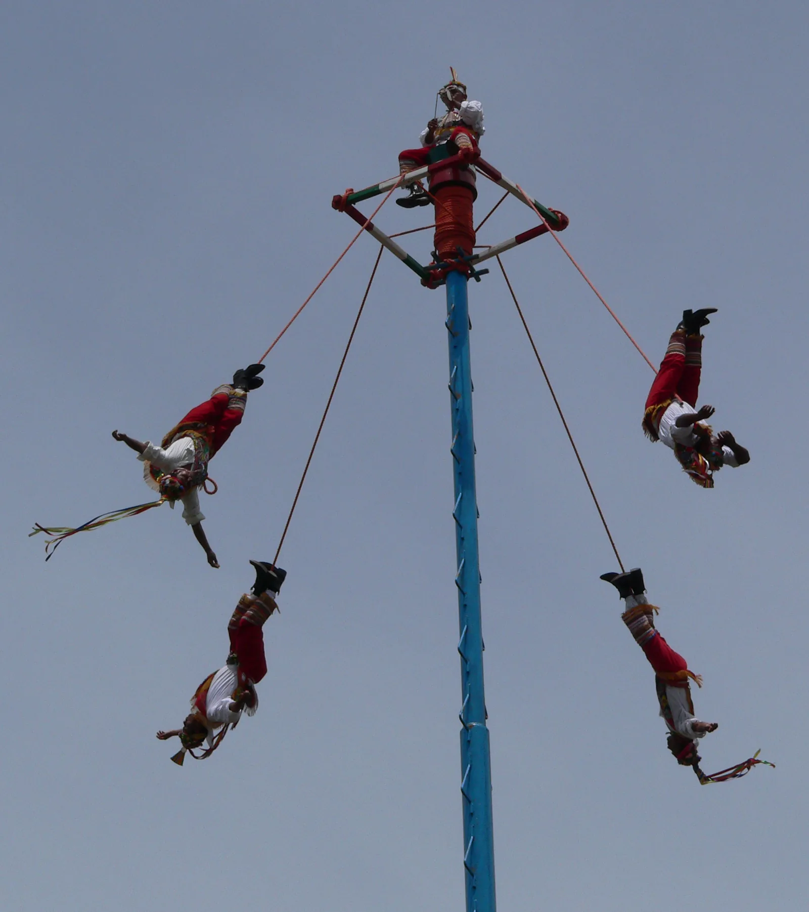 Voladores de Papantla performing the Ritual Ceremony of the Voladores at El Tajín Veracruz — four Totonac men descend from a 30-meter pole making 13 rotations each (52 total, the Mesoamerican calendar cycle), UNESCO File 00175 inscribed 2009